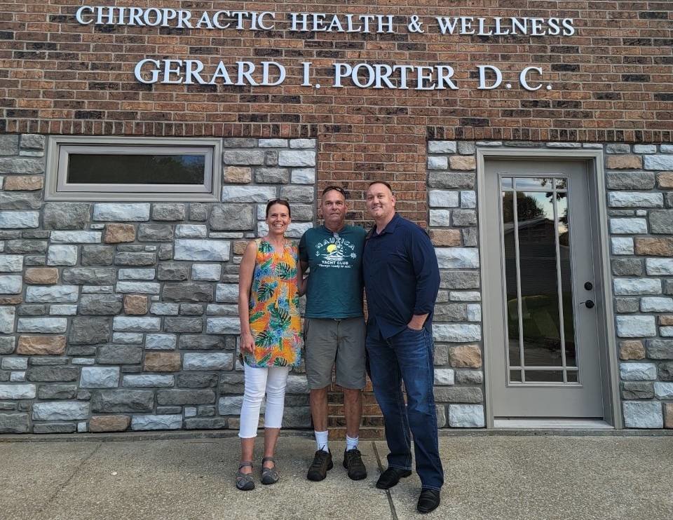 Dr. Steven Loehr, right, takes over Chiropractic Health & Wellness from Dr. Gerard Porter, center. Porter’s wife, Brenda, is pictured at left.